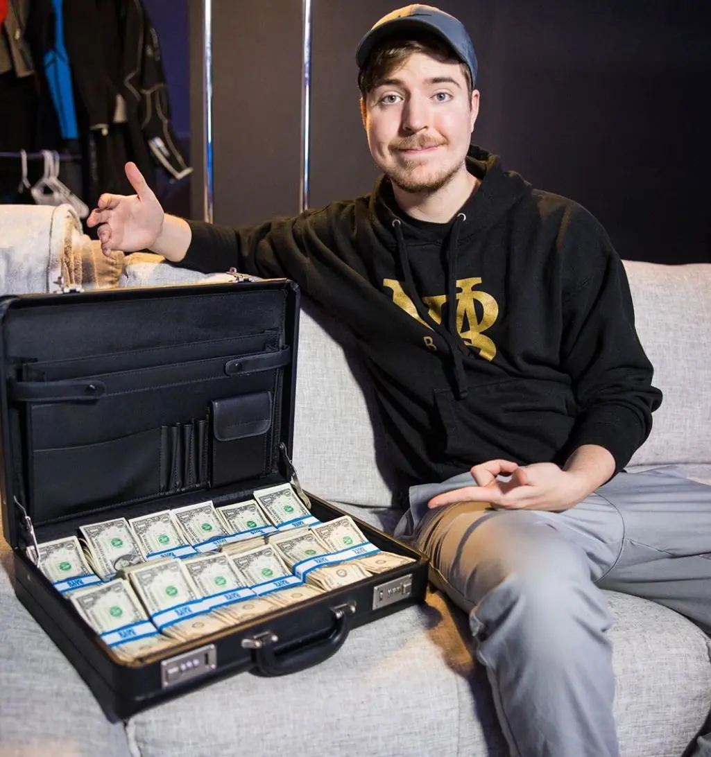 MrBeast sits next to cash