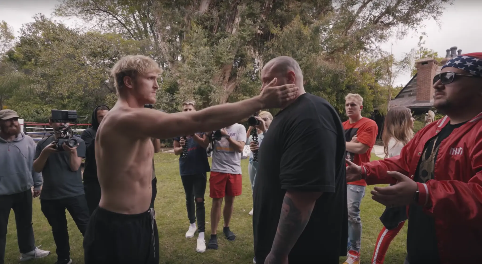 Logan Paul slapping a man.