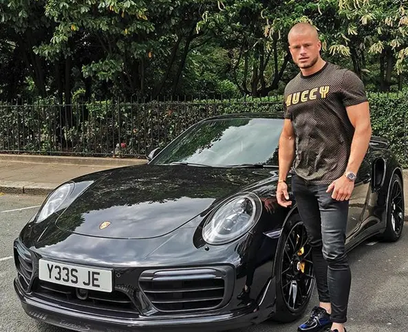 James standing beside his Porsche 911 Turbo S