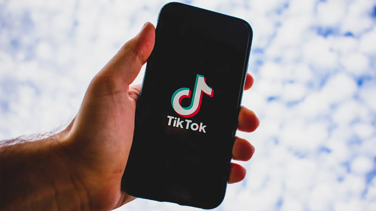 TikTok launch screen in front of sky