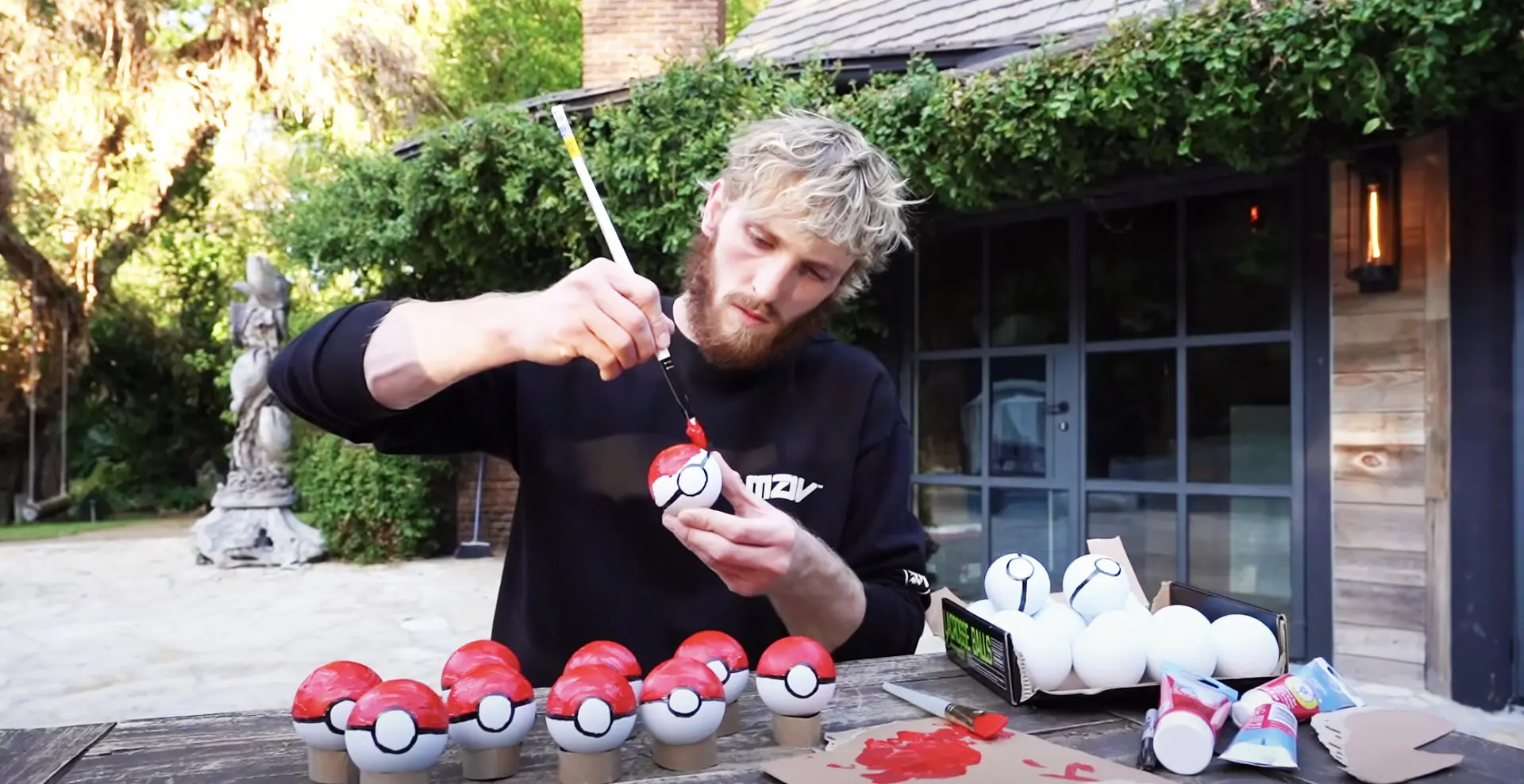 logan paul painting pokeballs