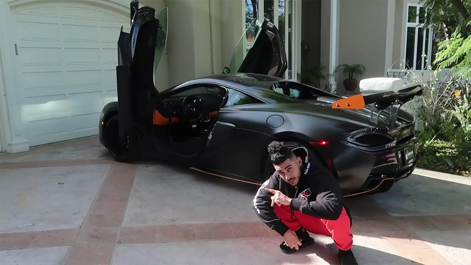 FaZe rain by his McLaren 