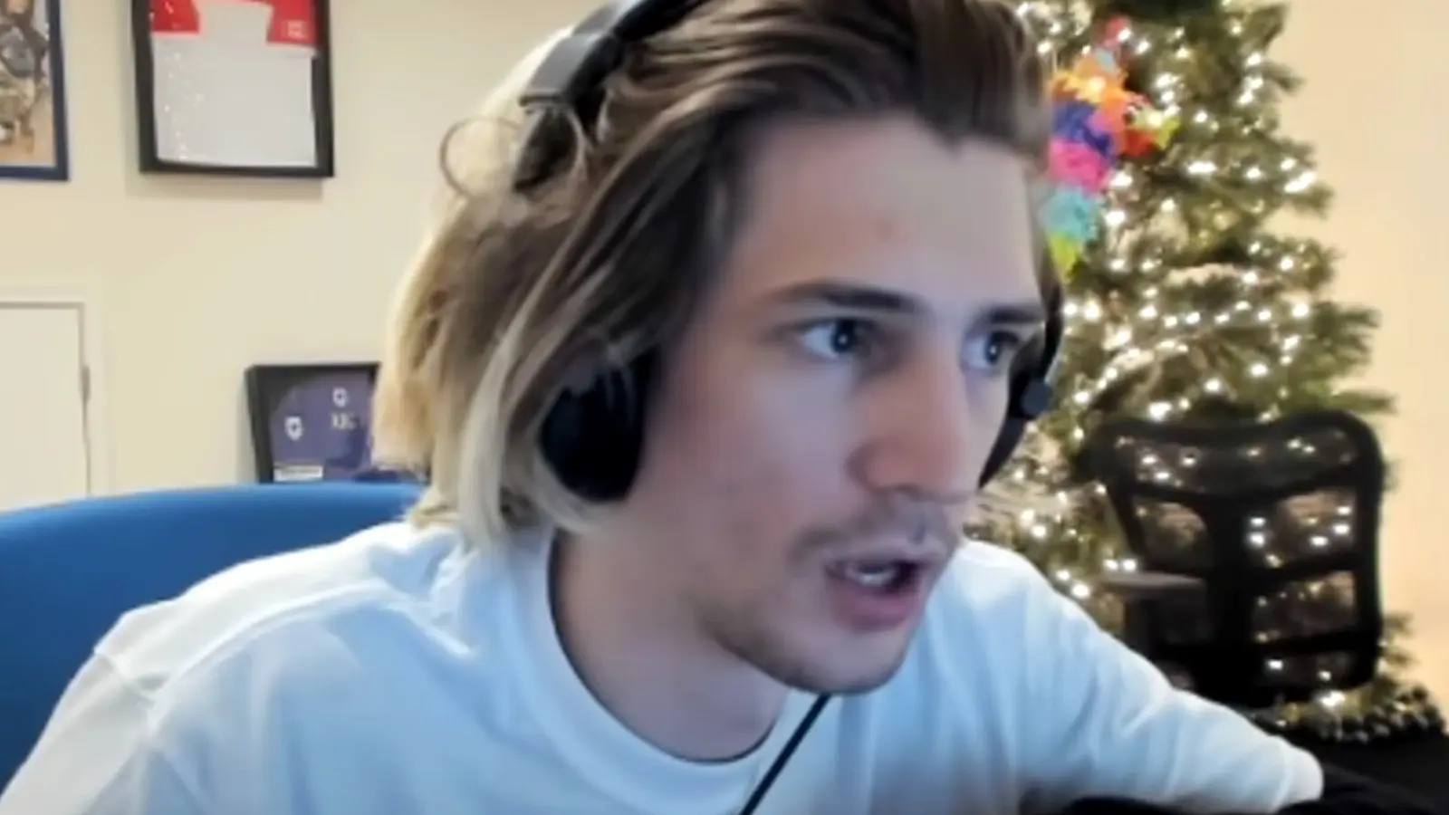 xQc with headphones on