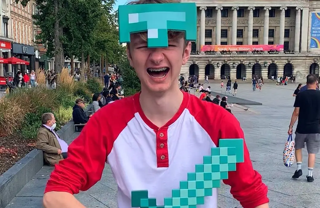 TommyInnit wearing minecraft helmet and sword