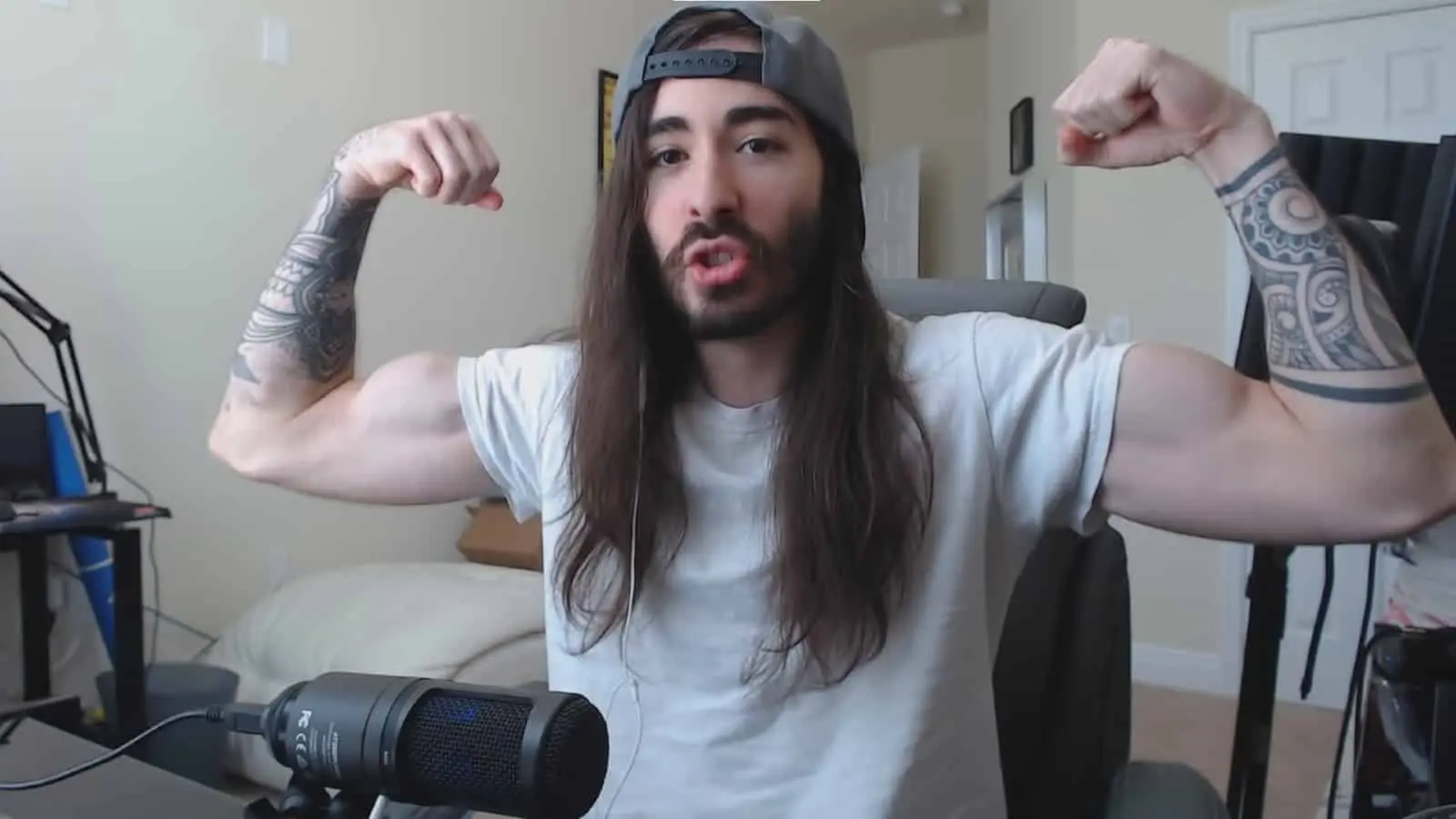 MoistCr1TiKaL flexing arms.