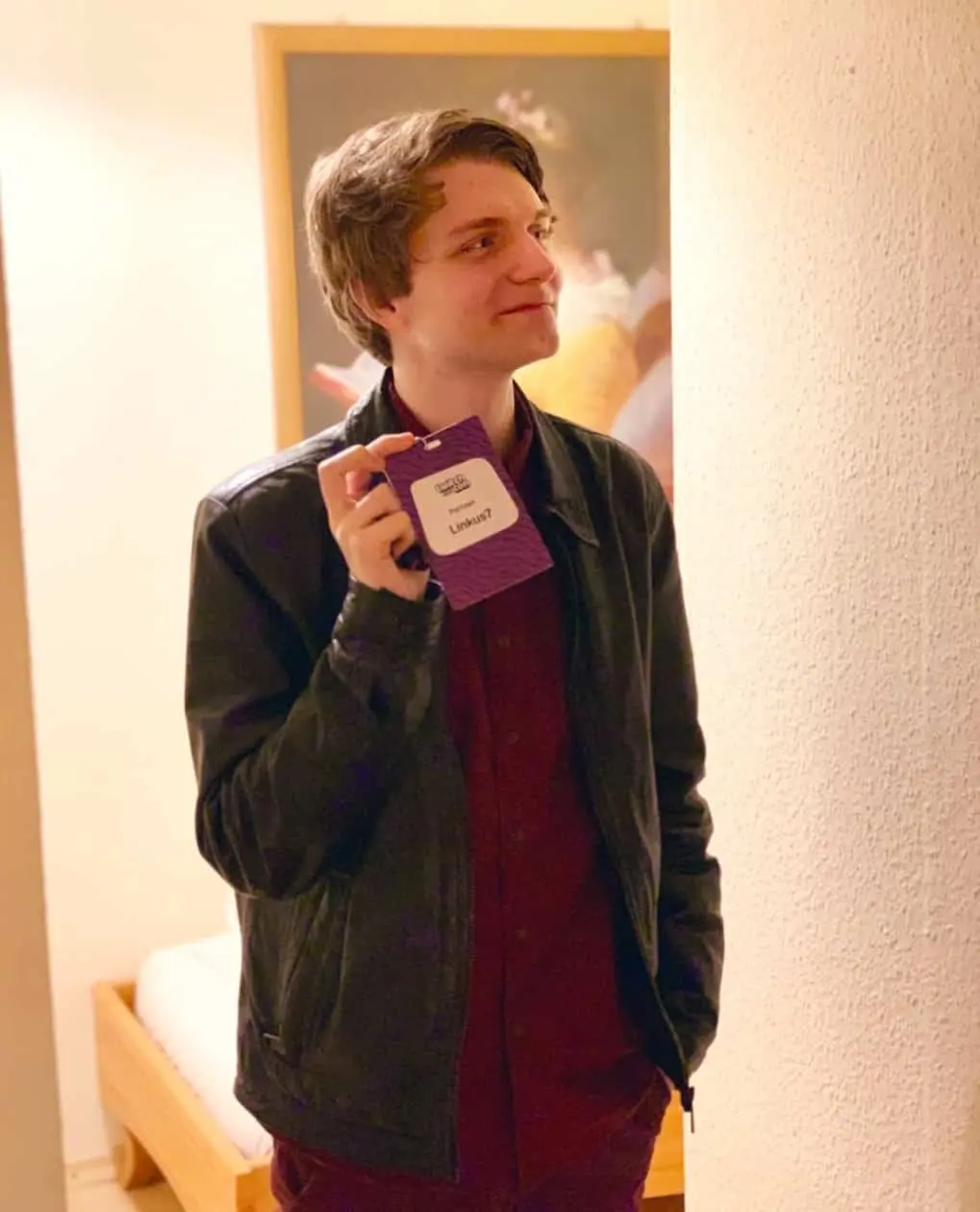 Twitch streamer Linkus7 holding TwitchCon badge