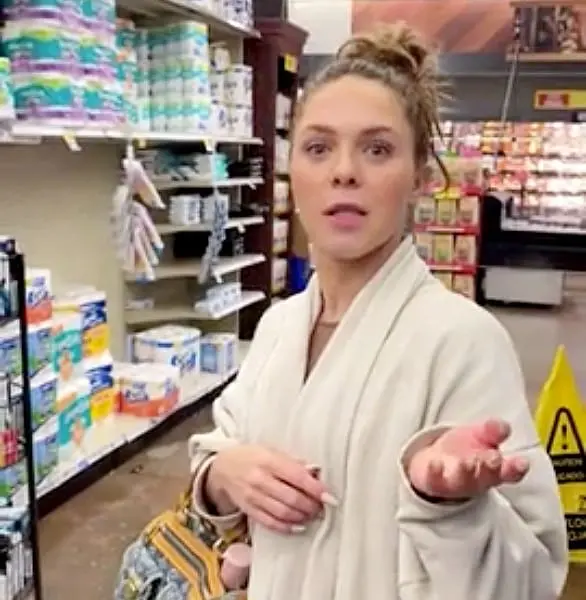 Woman stands in a grocery store