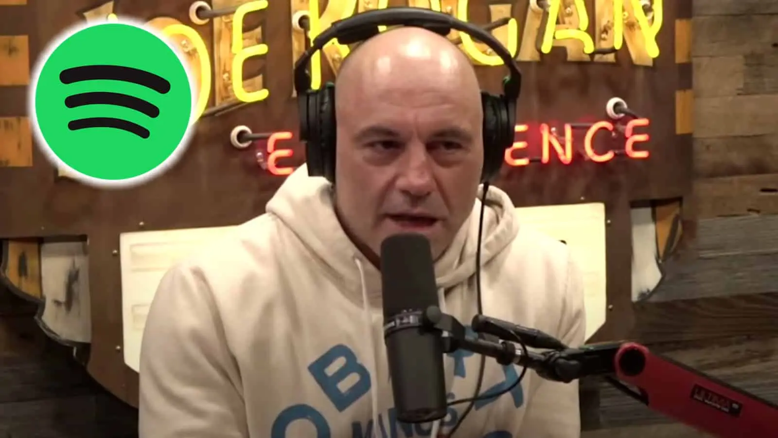 Joe Rogan next to the Spotify logo