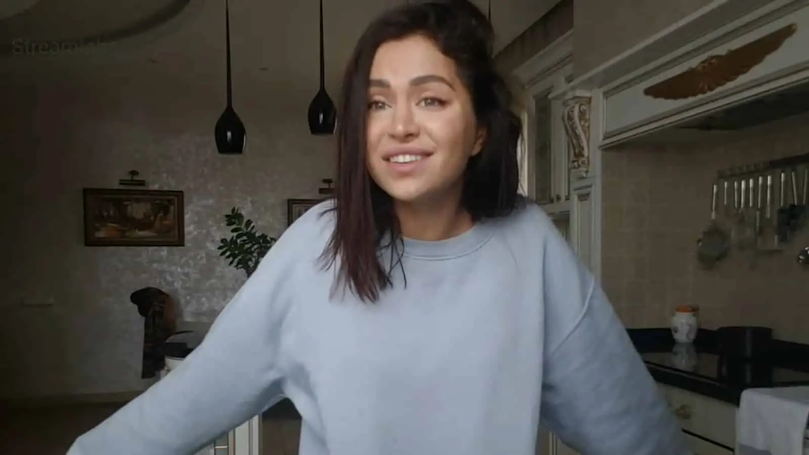 Mira wearing blue sweater