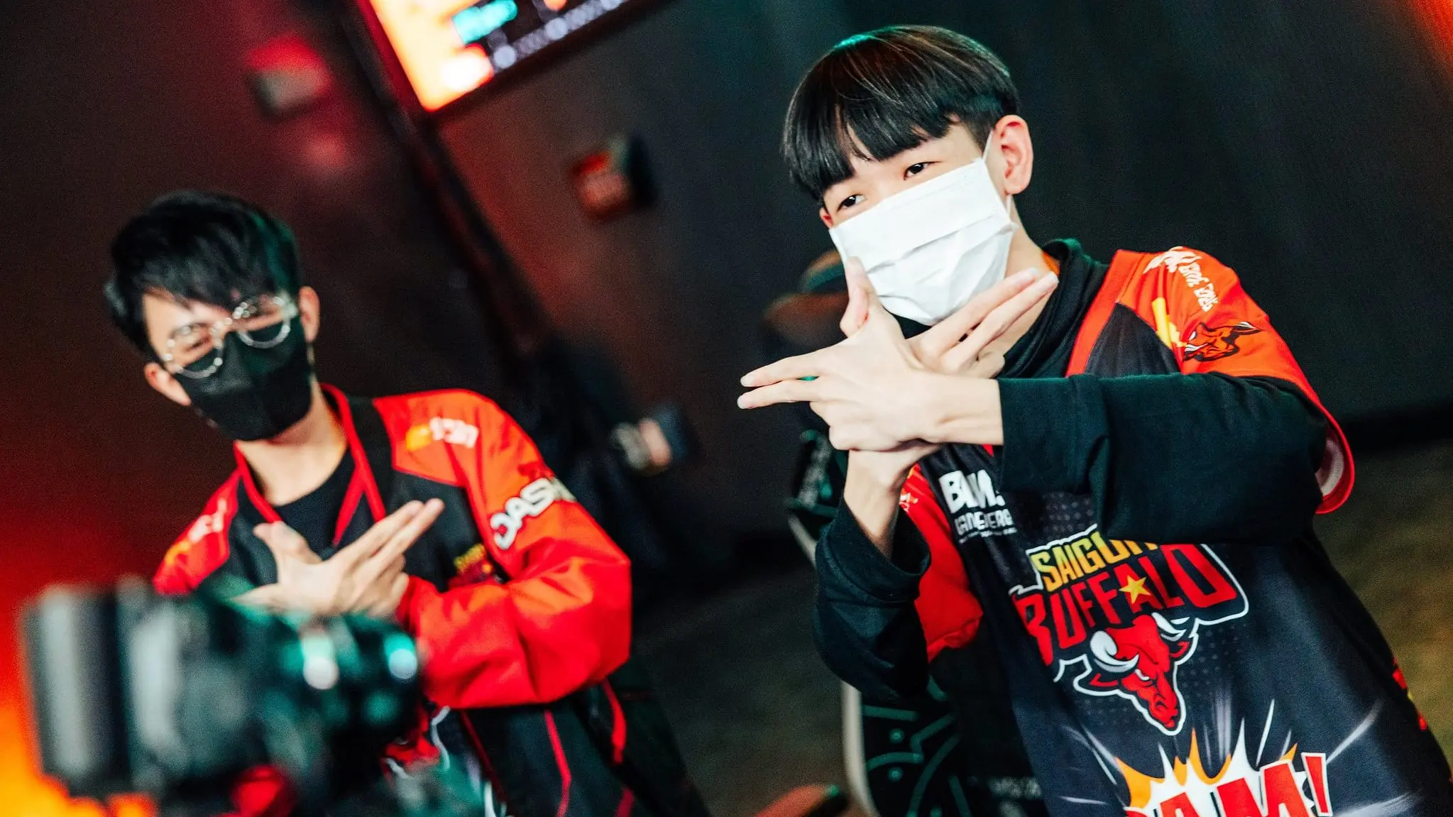 BeanJ holding up finger guns in Saigon Buffalo jersey at MSI 2022