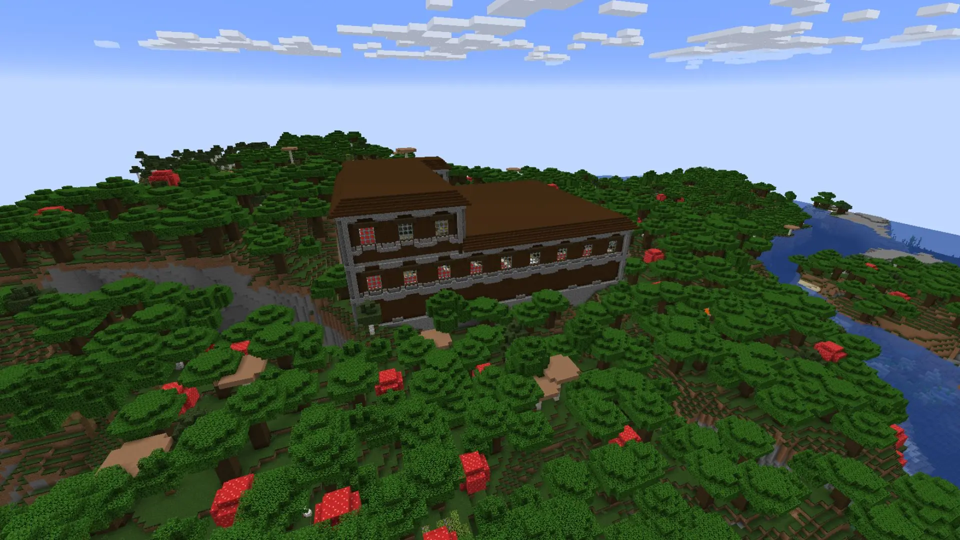 Woodland mansion in a field