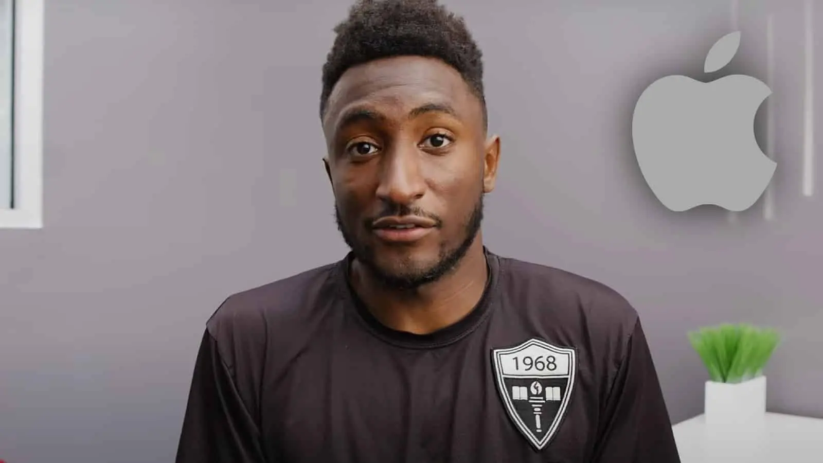 marques brownlee in video with apple logo in corner