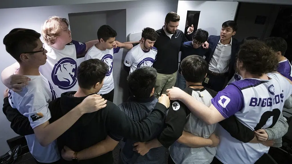 The LA Gladiators in a team huddle