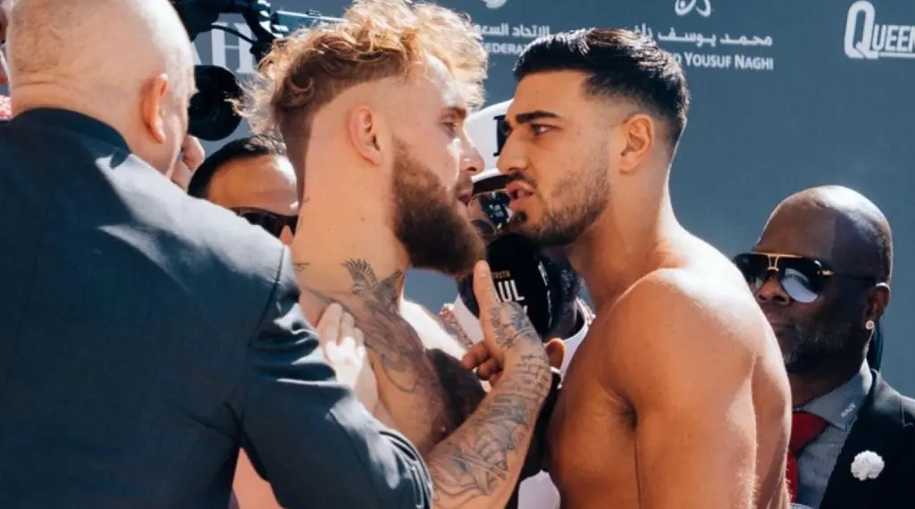 Tommy Fury and Jake Paul facing off on stage