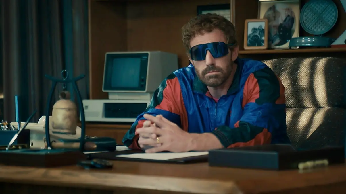 Ben Affleck as Phil Knight, sitting in his office, in Air.