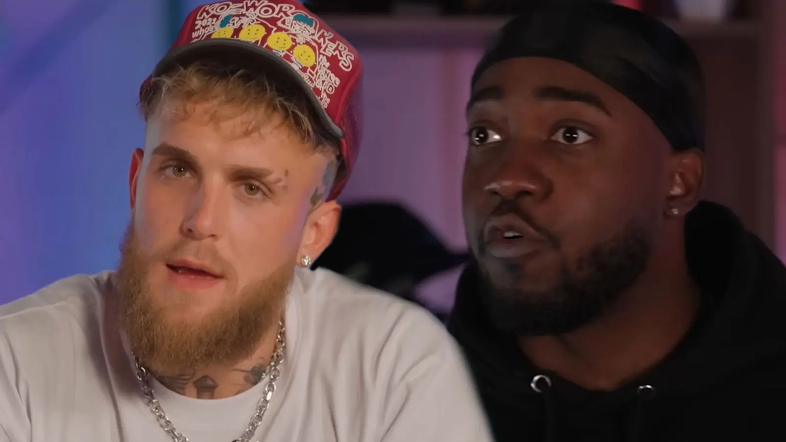 Jake Paul wearing white t-shirt next to JiDion wearing black hoodie