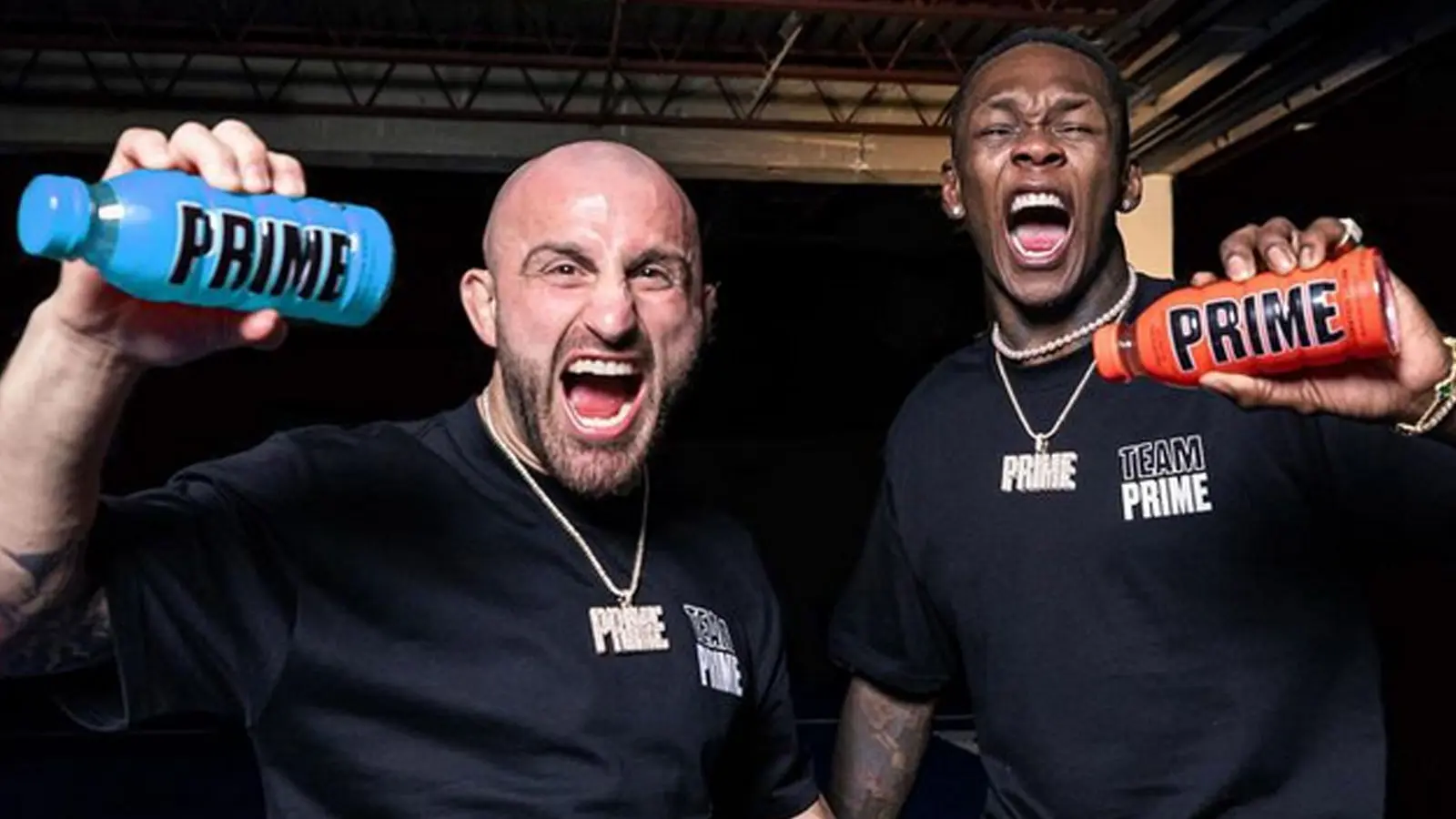 UFC fighters Israel Adesanya and Alex Volkanovski holding a bottle of Prime