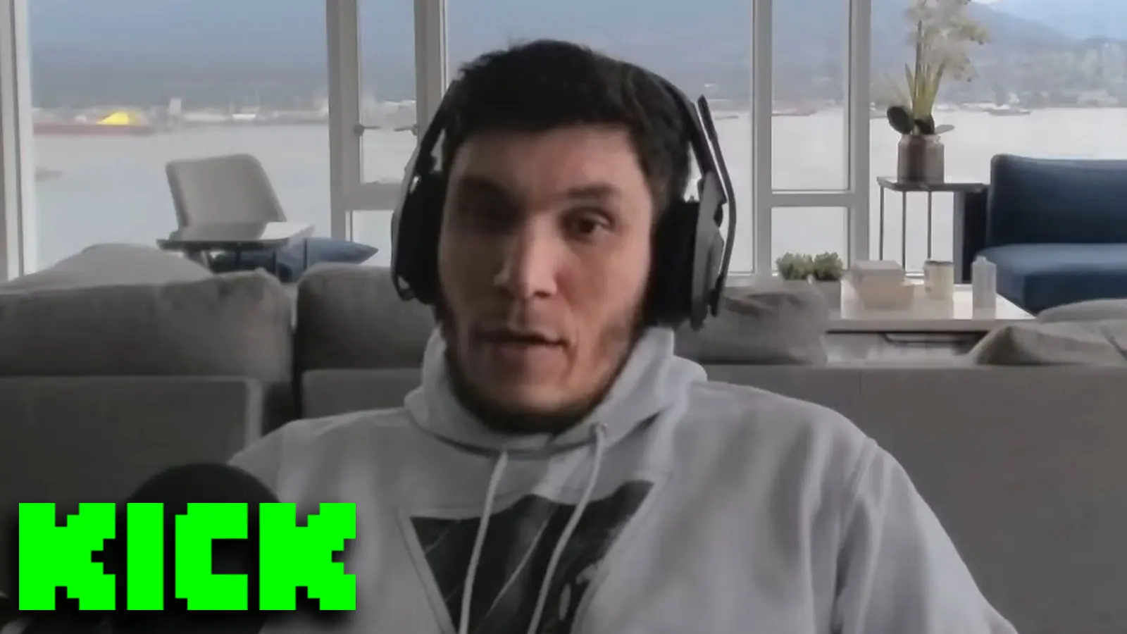 Trainwrecks sat at desk with Kick logo