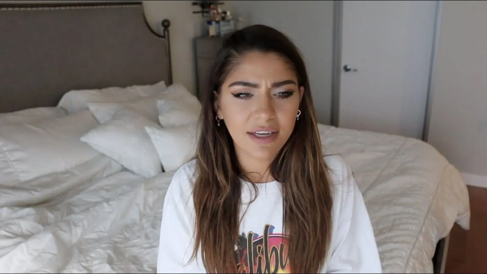 Andrea Russett in a white t-shirt