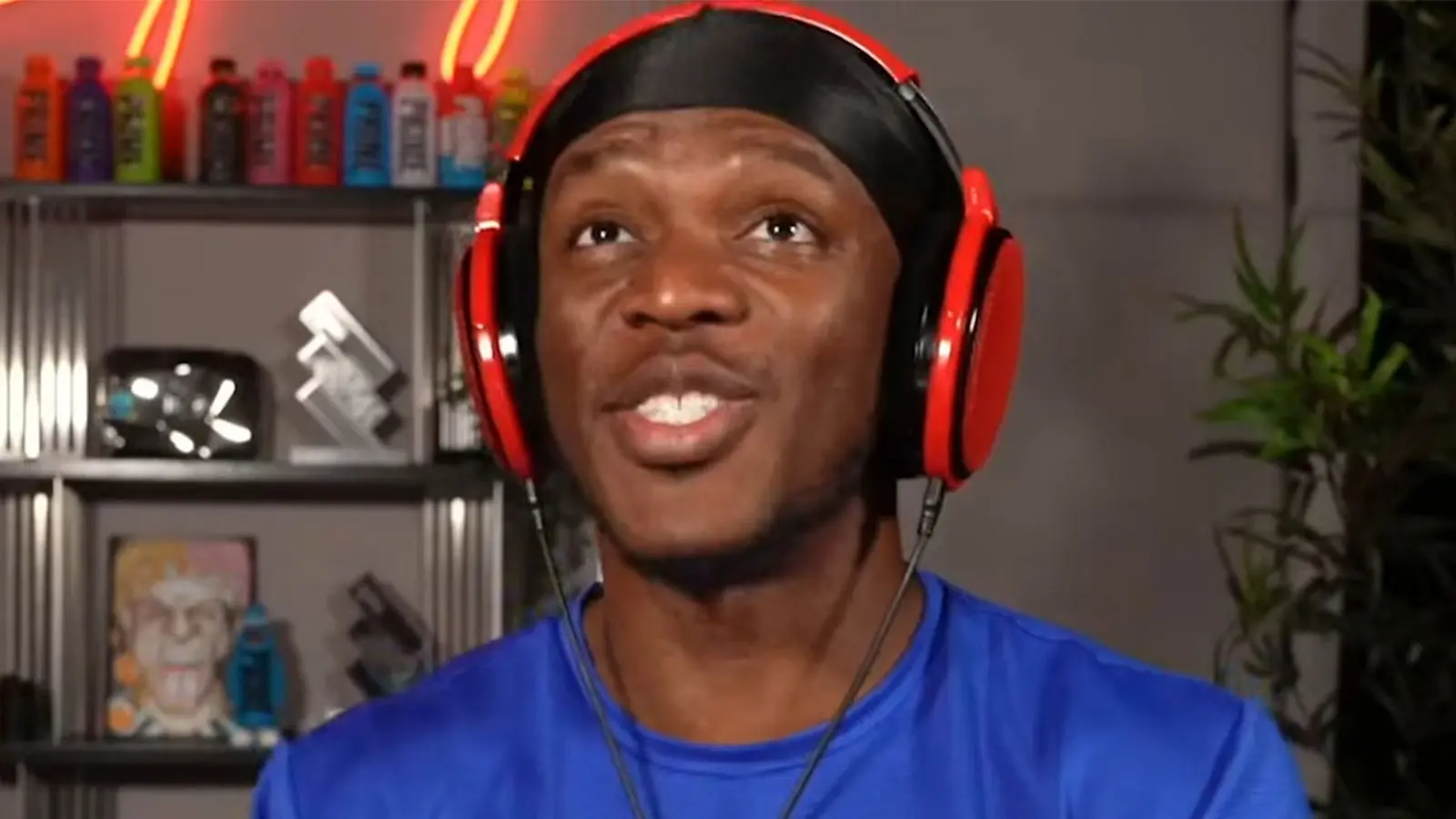 KSI wearing blue shirt at his desk