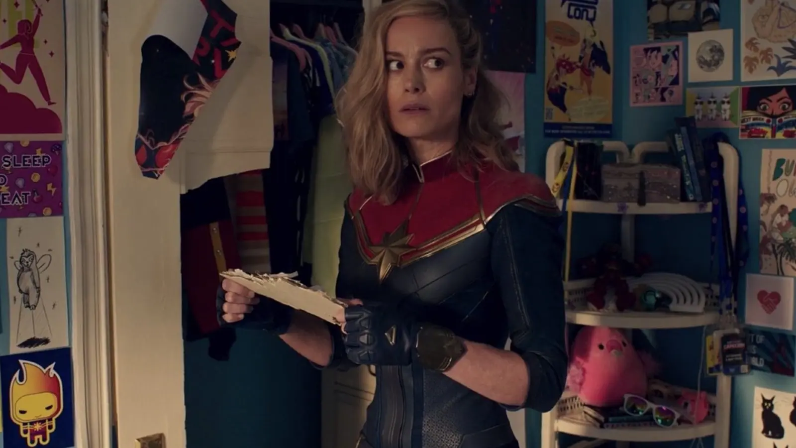 Captain Marvel in Ms. Marvel's room.