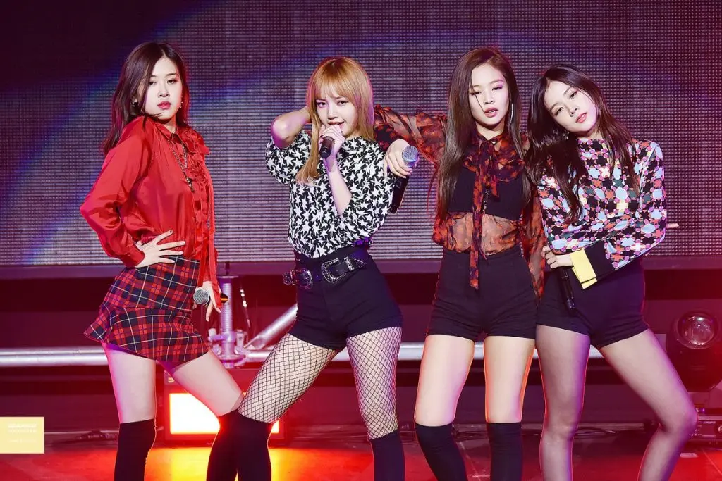 Blackpink performing onstage at a concert