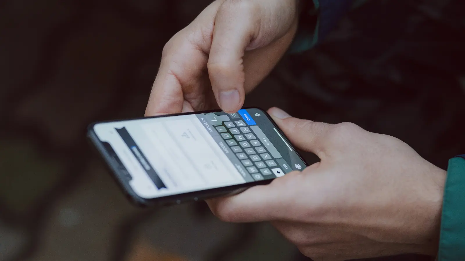 iPhone being used for sending text message