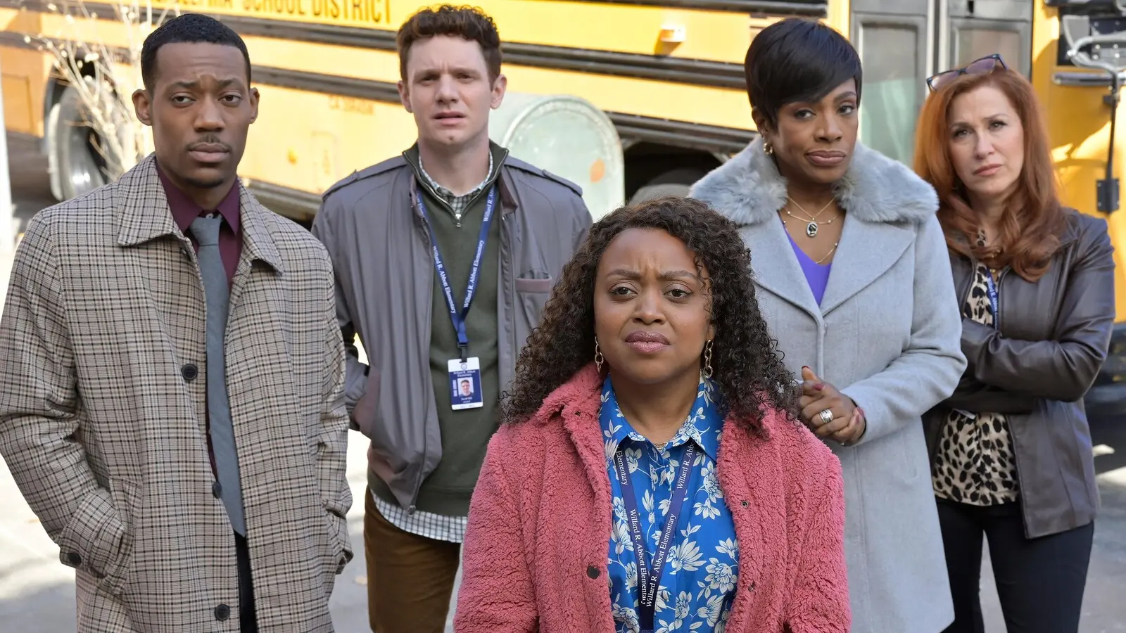 Abbott Elementary cast in front of a school bus