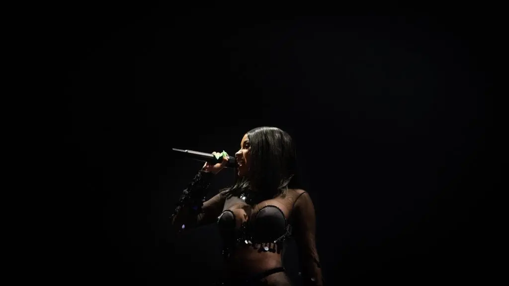 Cardi B performing onstage at a concert