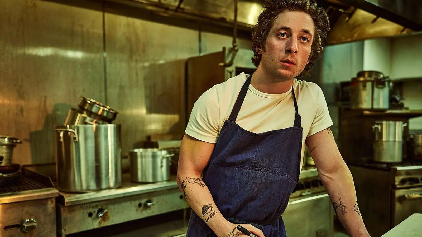 Jeremy Allen White as Carmy in The Bear's kitchen.