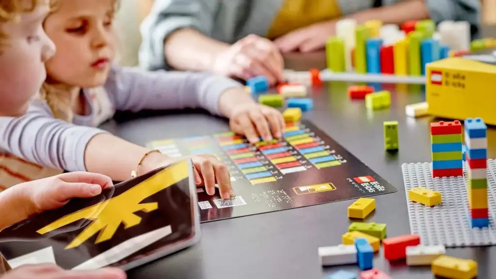 Children playing with their LEGO Braille Bricks