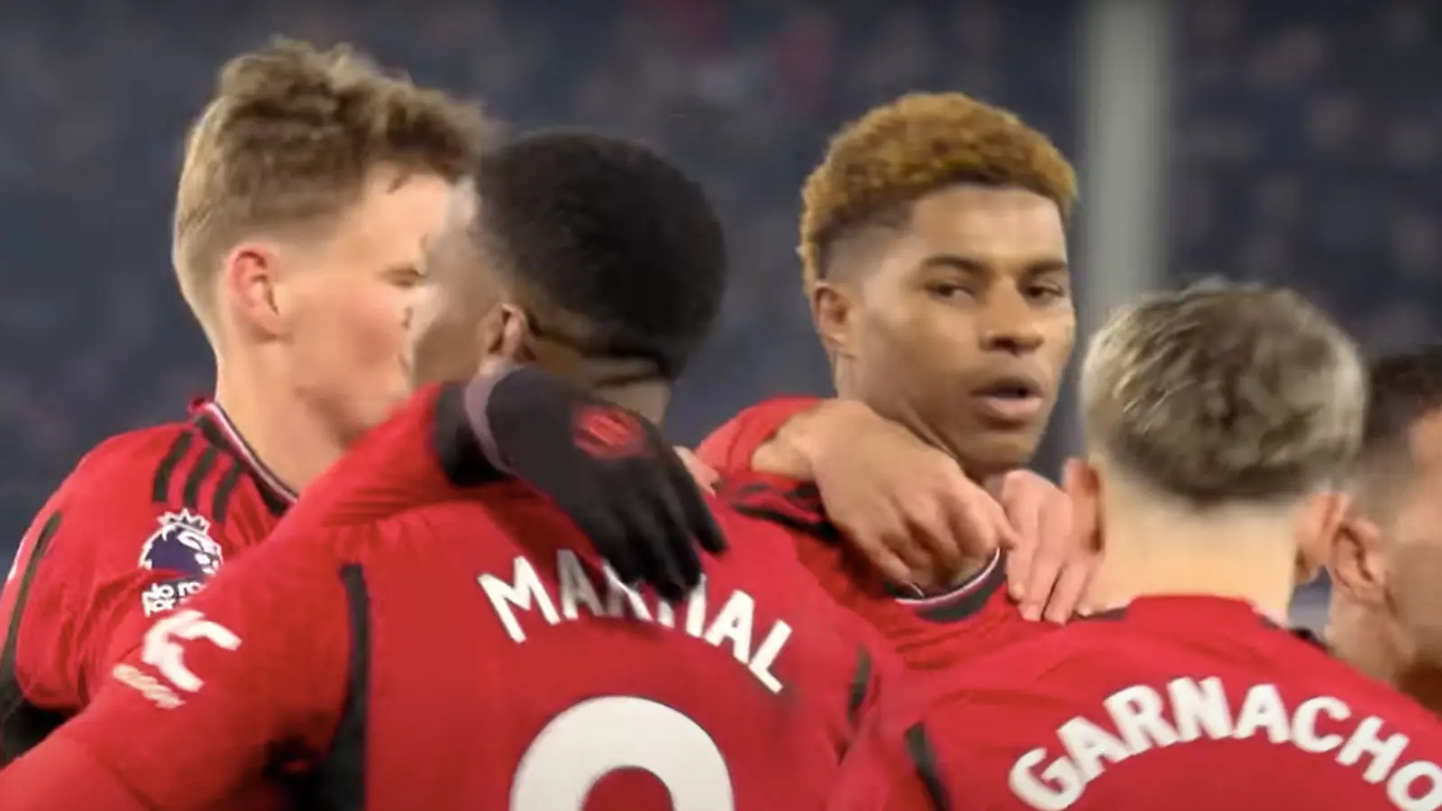 Marcus Rashford celebrates with Manchester United teammates.