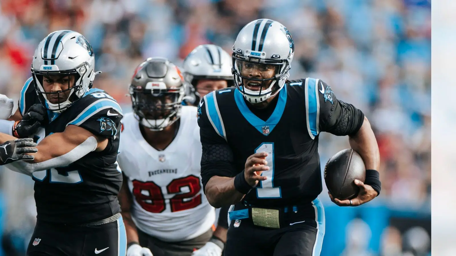 Cam Newton running the football in a game as a member of the Carolina Panthers.