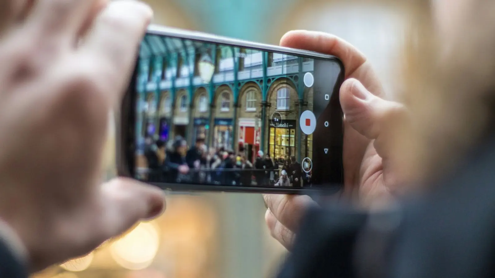 A person filming something with a phone