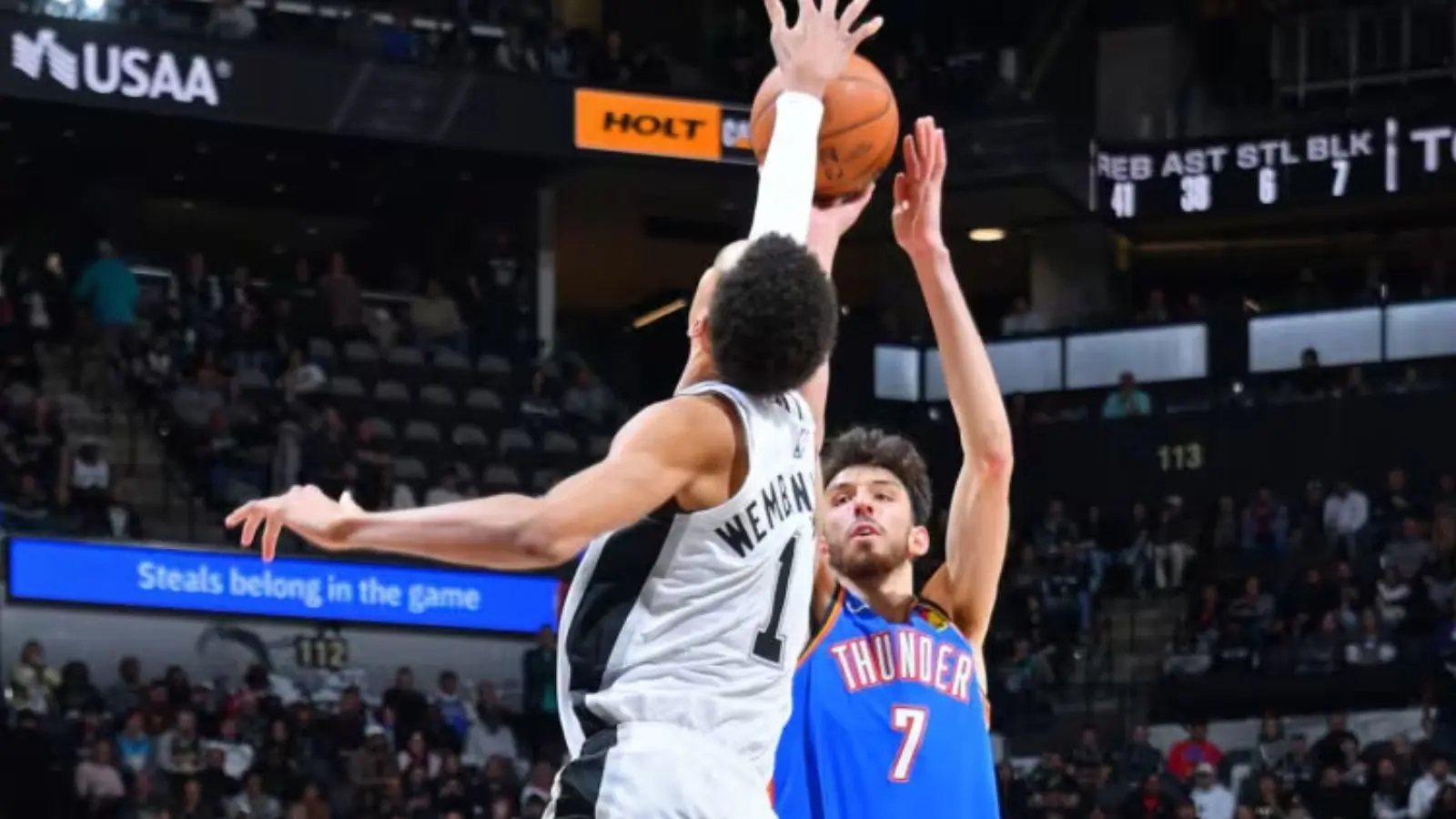 San Antonio Spurs center Victor Wembanyama blocks Oklahoma City Thunder's Chet Holmgren.