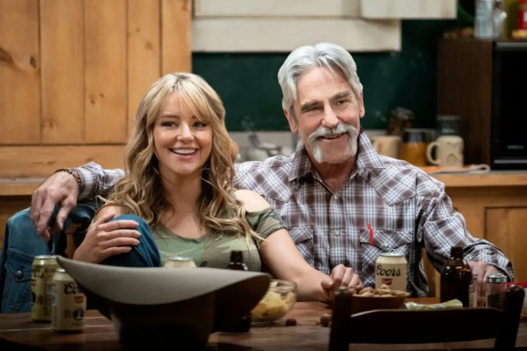 Laramie and Lloyd in Yellowstone, sitting at the table