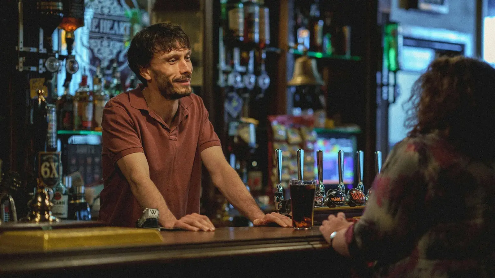 Richard Gadd behind the bar in a pub during Baby Reindeer.