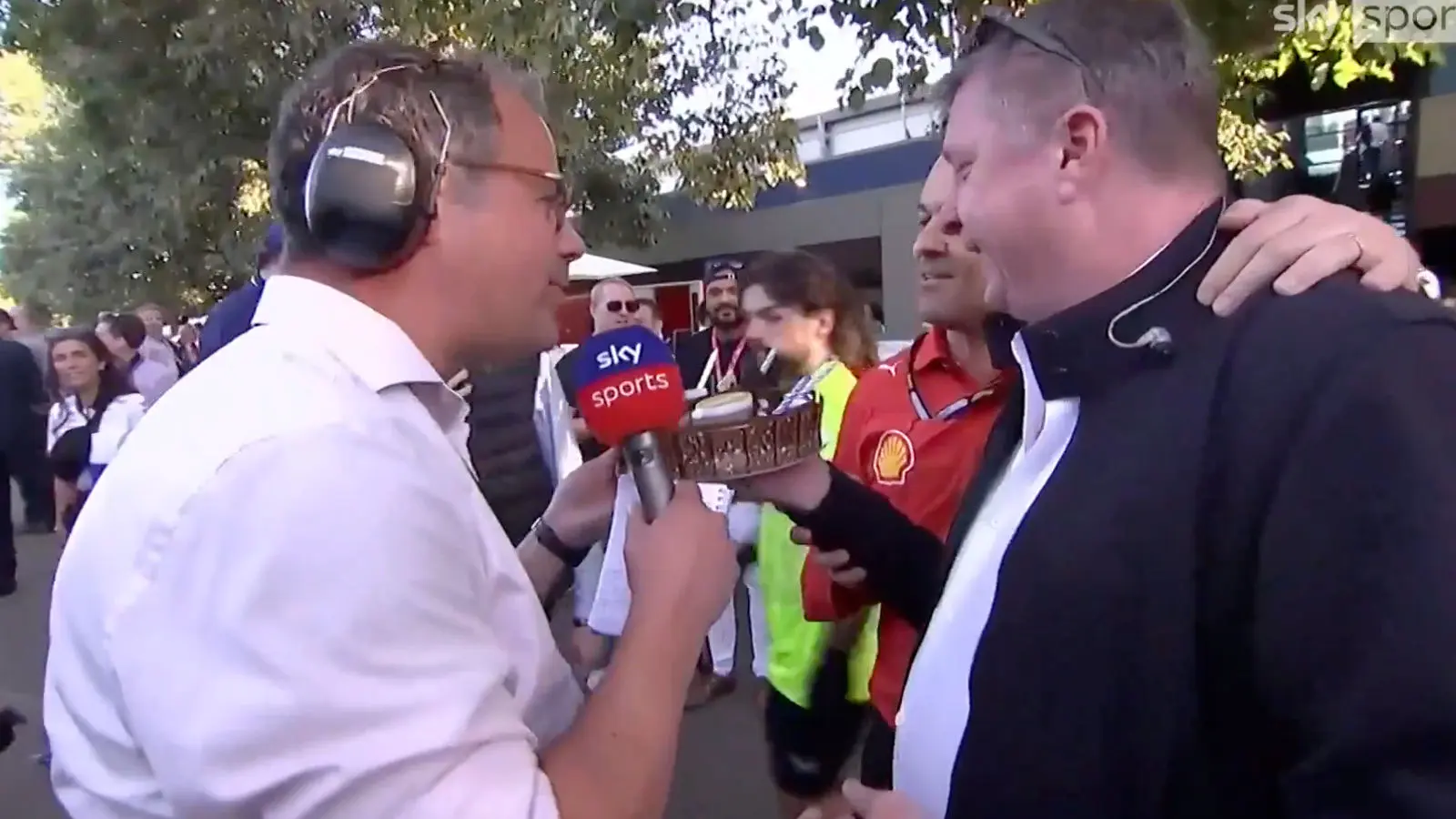 Ted Kravitz is presented with a birthday cake live on air