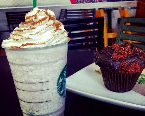 A starbucks cinnamon frappuccino and a muffin