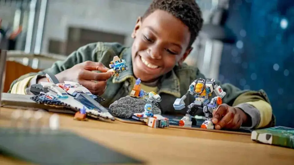 A child playing with the LEGO City Space Explorers Pack