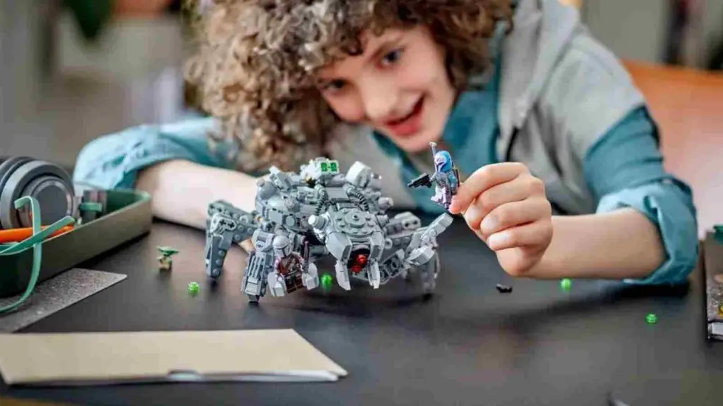 A child playing with their LEGO-reimagined Spider Tank.