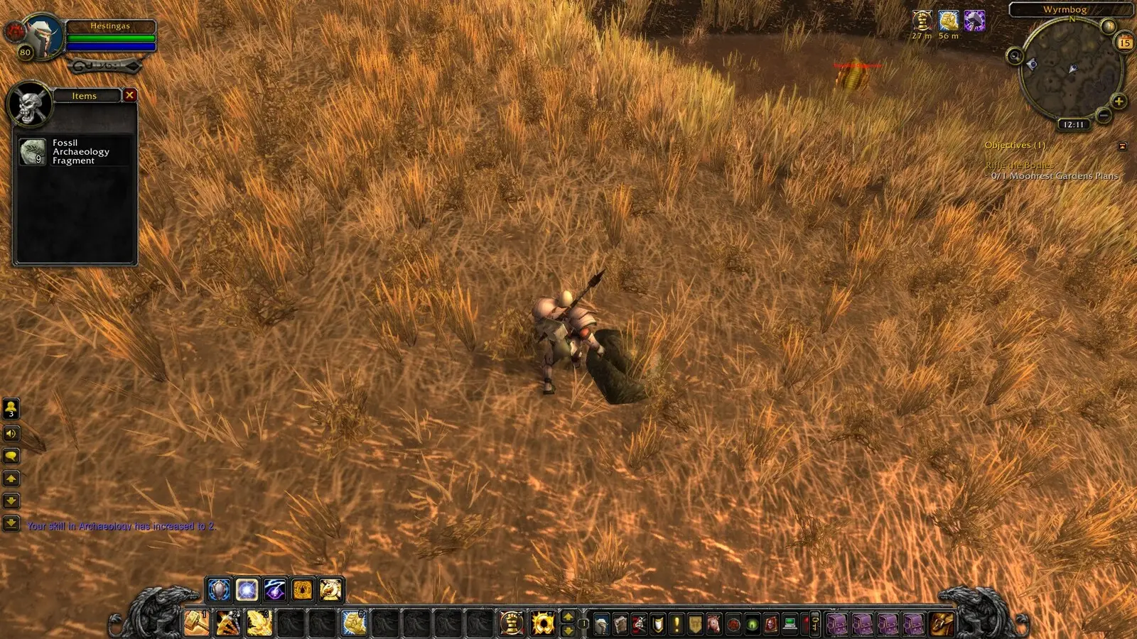 A player digging up a fossil fragment using Archaeology in Cataclysm Classic