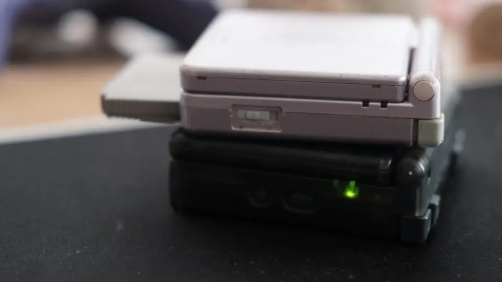 anbernic sp stacked on top of a regular gameboy advance sp