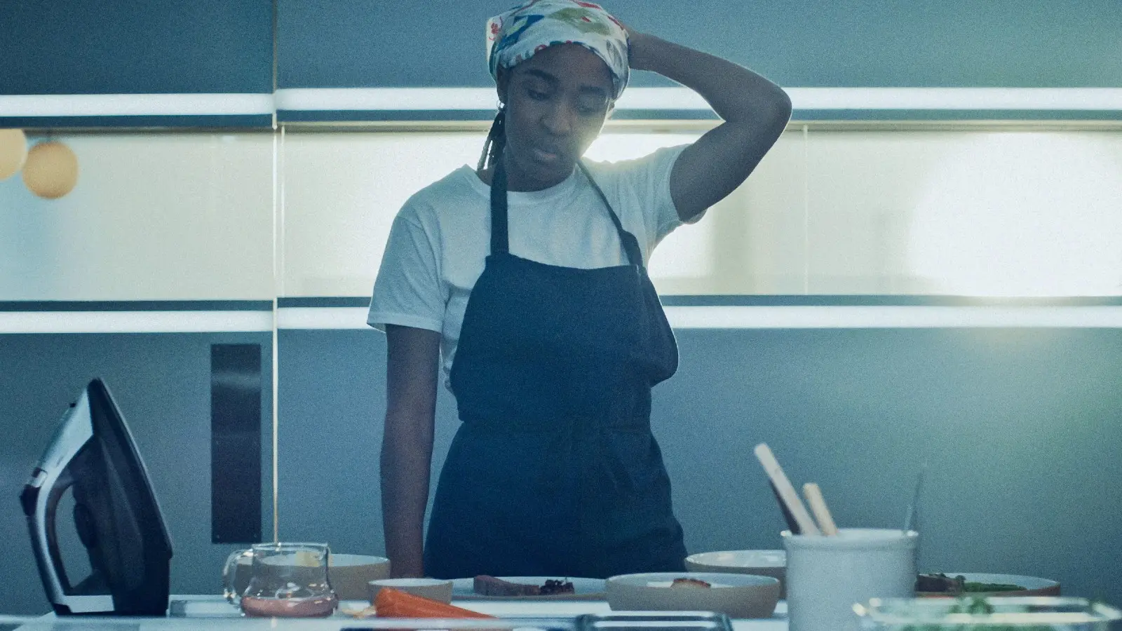 Sydney looking stressed in the kitchen of The Bear.