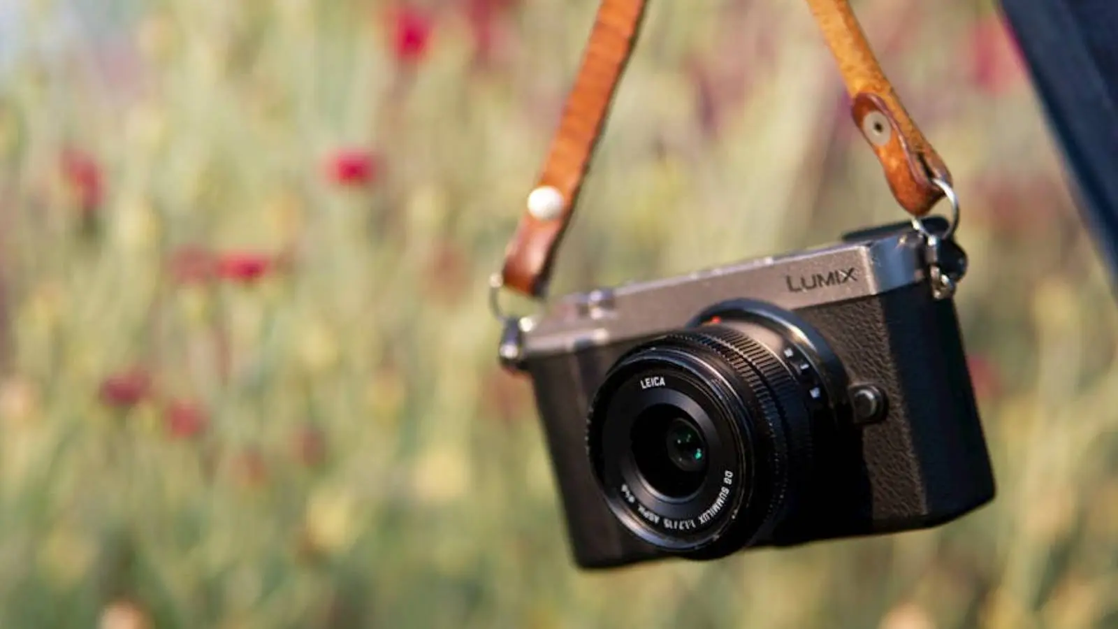 Photo by Aaron Burden of a 'Close-up of Person Holding a Digital Camera on a Strap' from pexels.com