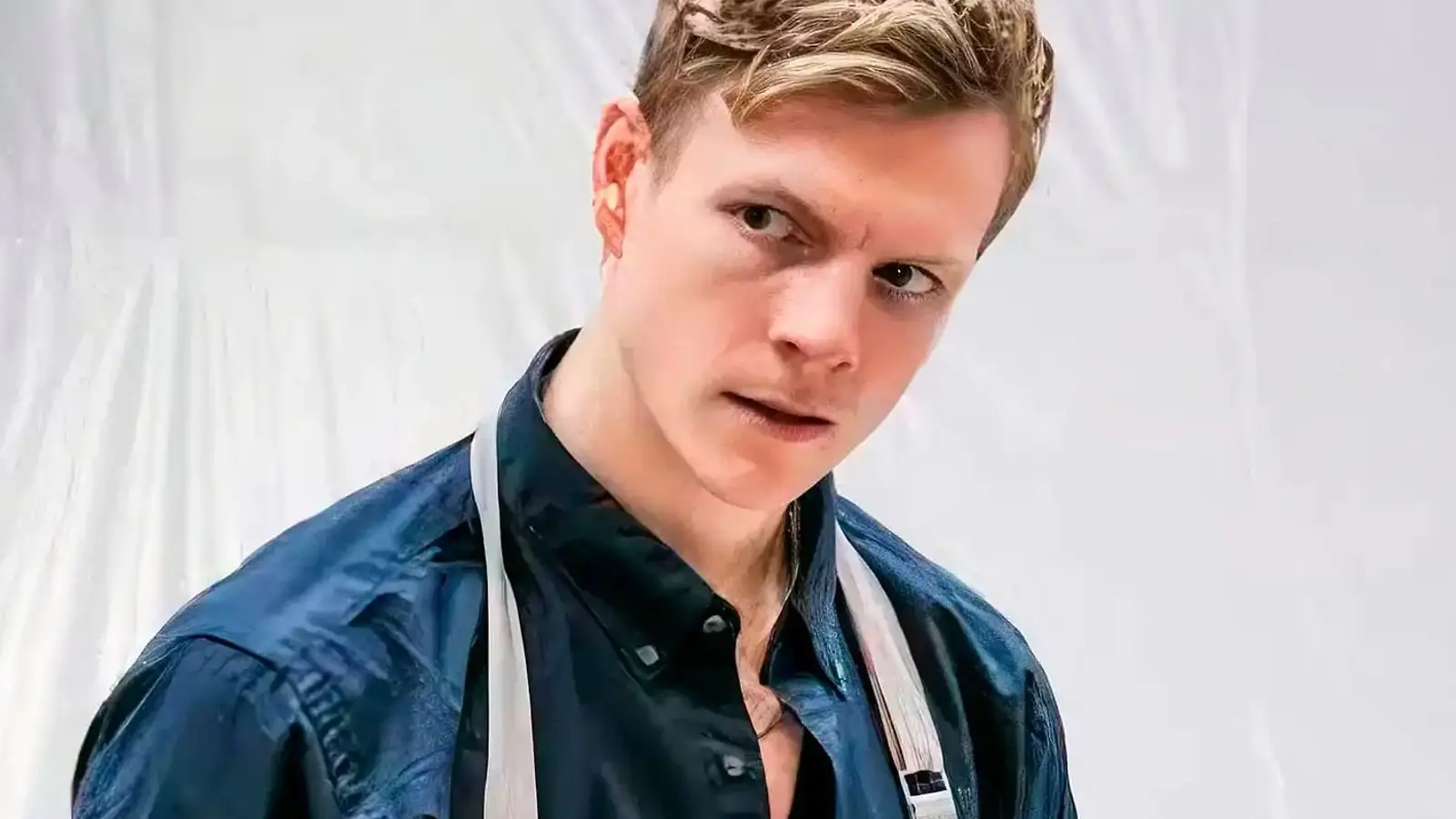 Patrick Gibson wearing an apron as young Dexter Morgan.