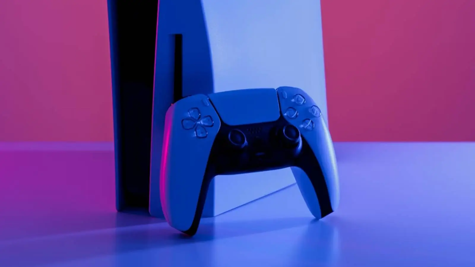 Close-up photo of the PS5 and its DualSense controller by Martin Katler on Unsplash