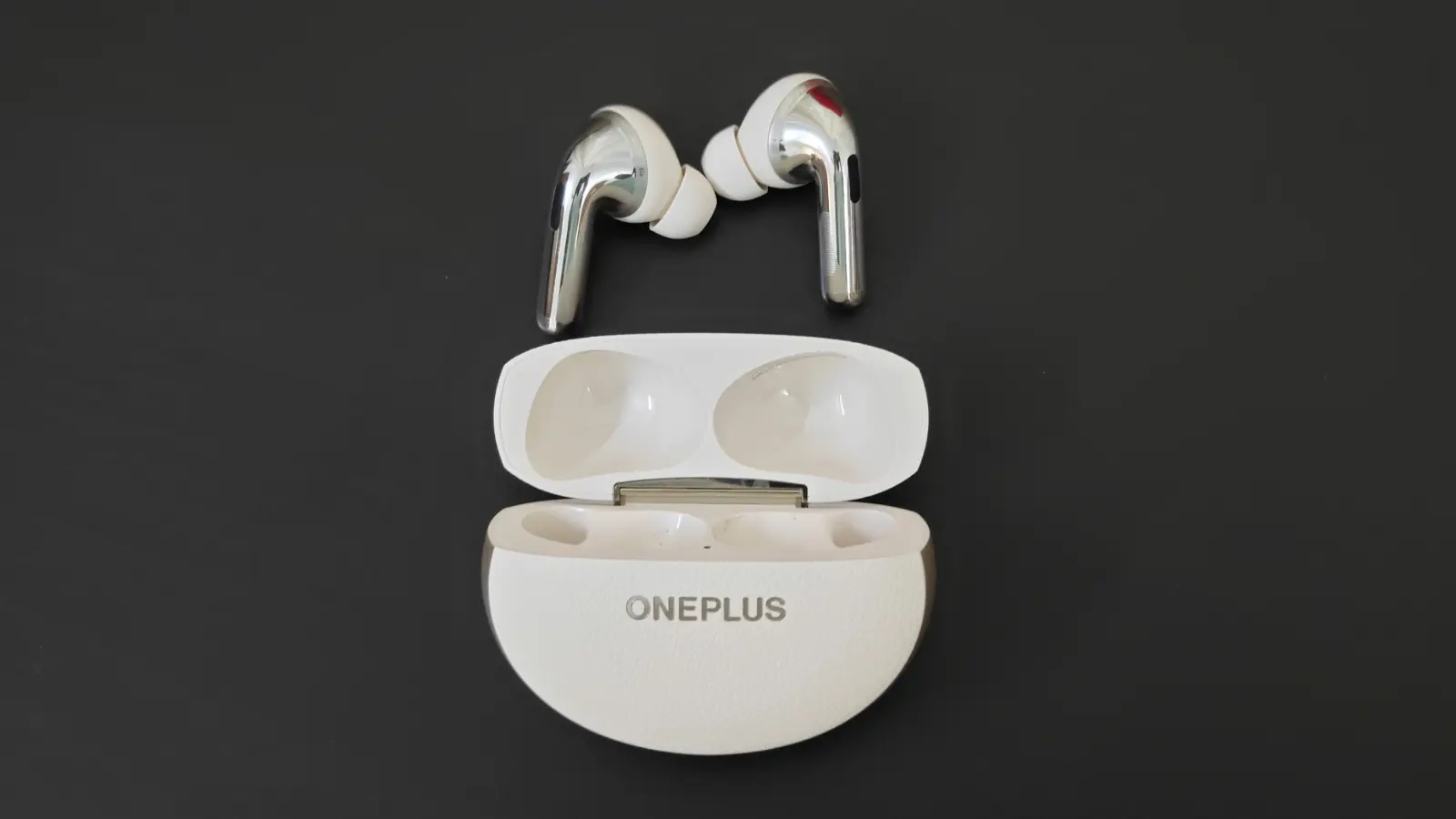 OnePlus Buds Pro 3 with case open and earbuds on the top.