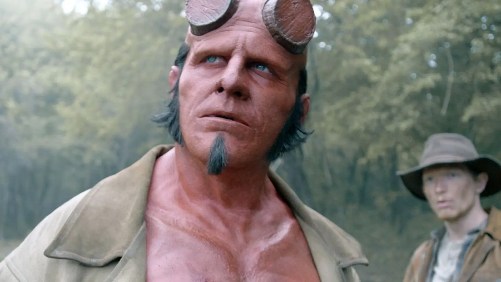 Jack Kesy looking mean and moody as Hellboy.