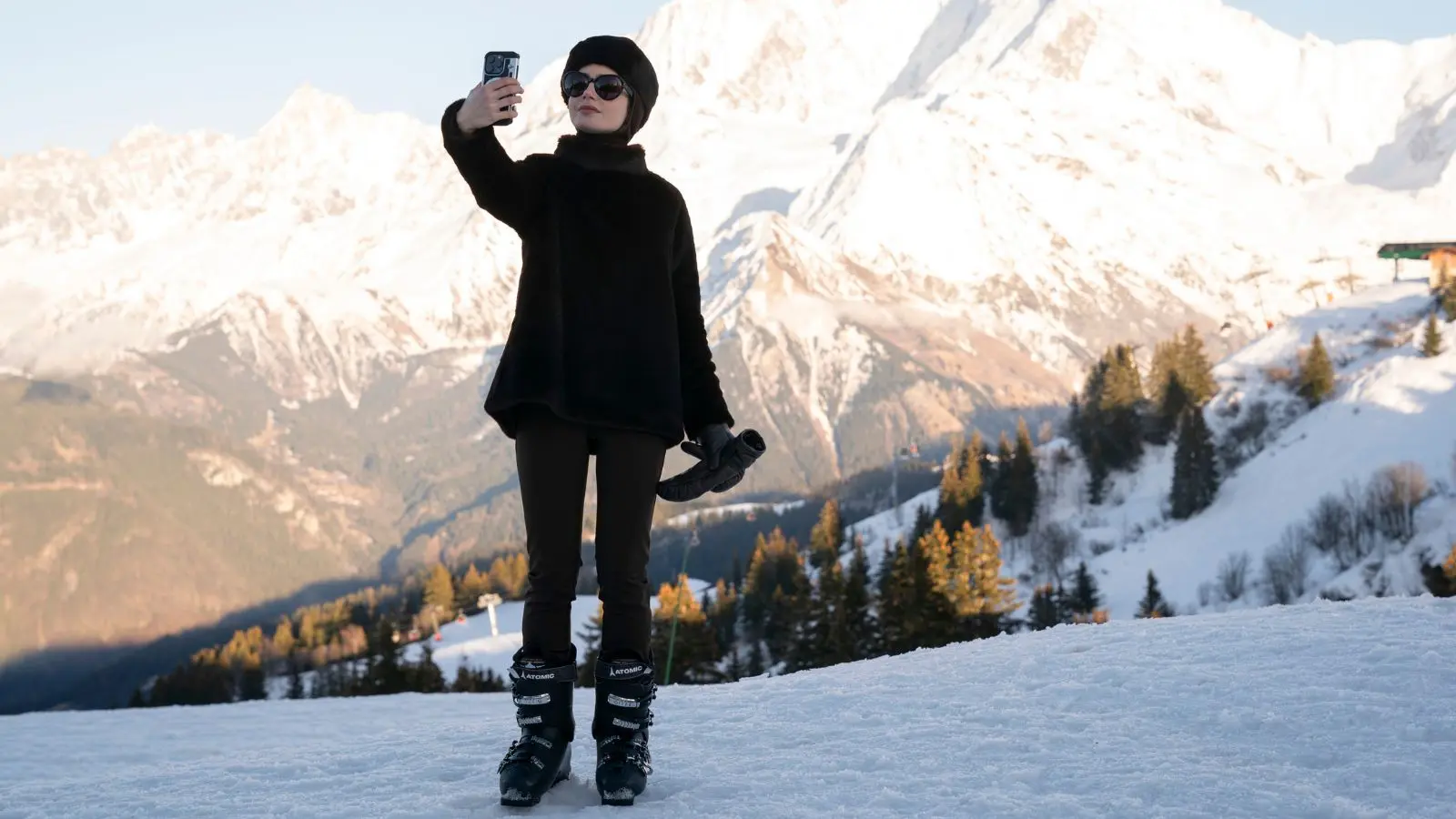 Emily taking a selfie on a mountain in Emily in Paris Season 4